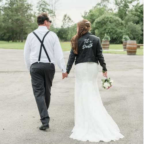 wedding couple at gizio in grimsby ontario with bride leather jacket