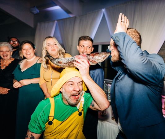a wedding guest is experiencing the Newfoundland tradition of being screeched in